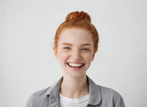 smiling woman with straight teeth