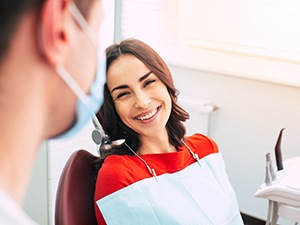 Happy patient smiling at her dentist