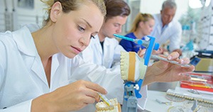 Technicians in dental laboratory, working on dentures