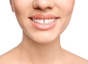 Woman’s smile with gap between two front teeth