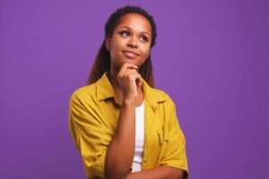 Beautiful woman wearing thoughtful, curious expression